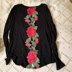 Long sleeved shirt with rose cut out on back